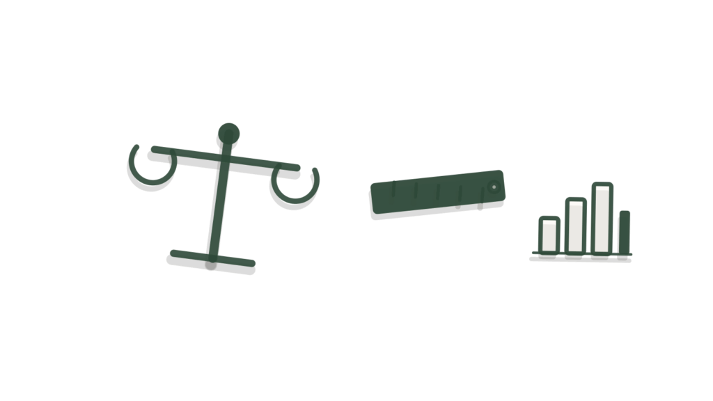 Brass scale balance beside a ruler and bar chart, representing budget weighed against actual spend.
