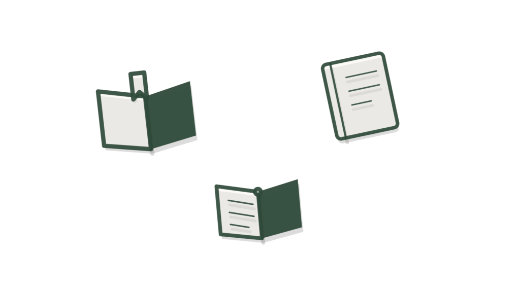 An open book with a brass tab beside a notebook and a second open book, showing knowledge ready to consult.